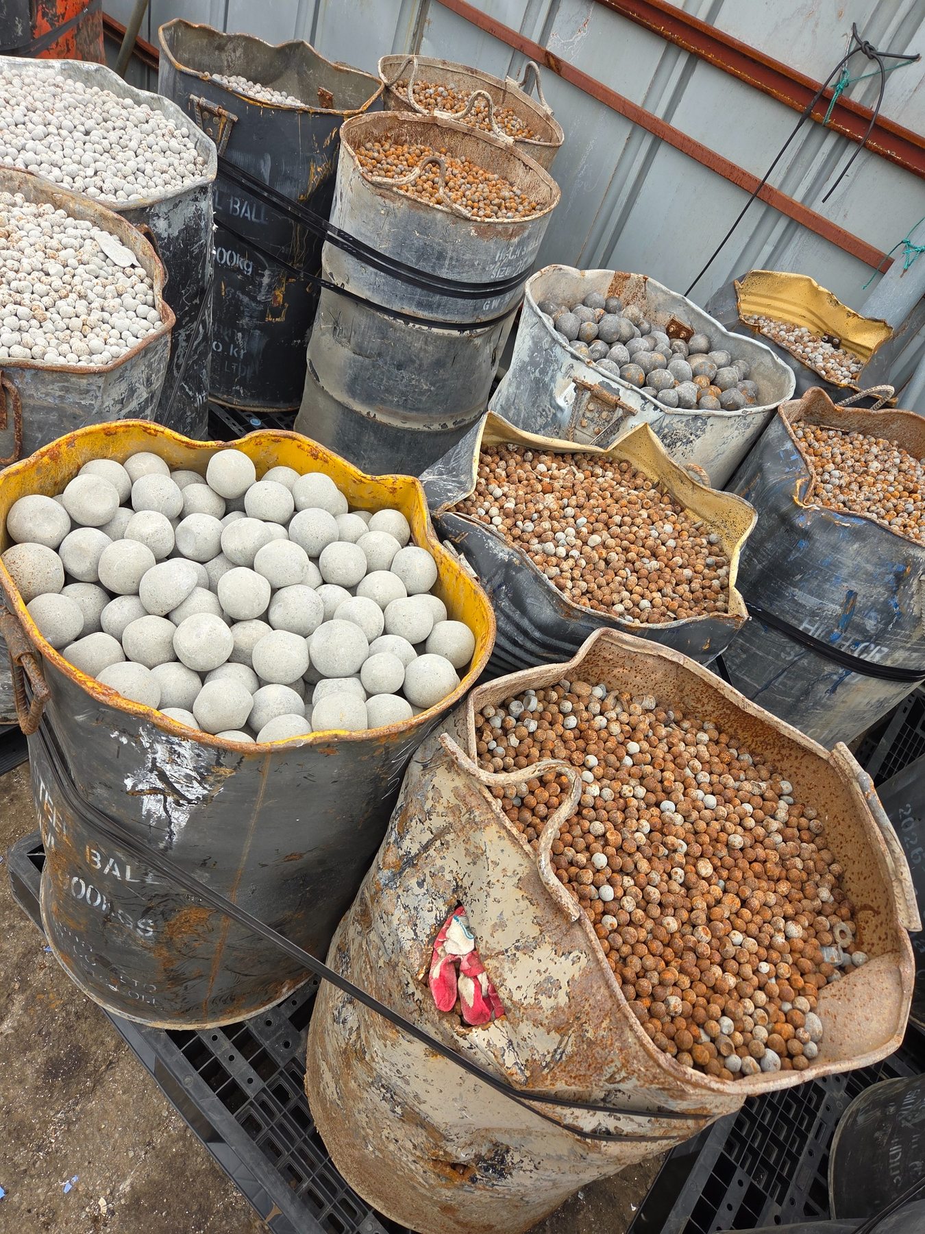 Grinding media balls with varied surface conditions