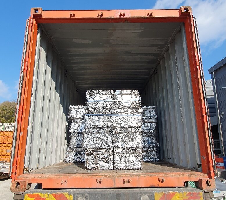 Bales of stainless steel scrap loaded into a shipping container
