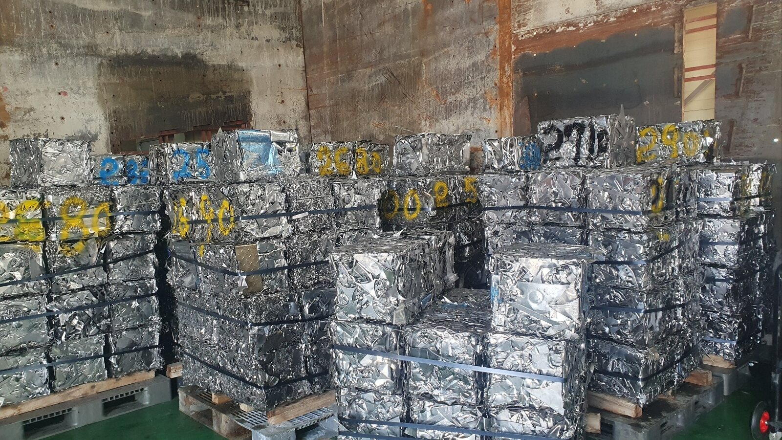 Baled stainless steel scrap stacked in a warehouse